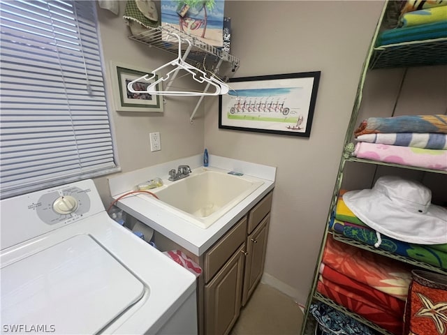 laundry area featuring washer / clothes dryer and sink