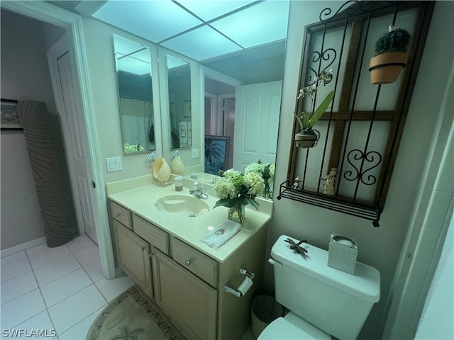 bathroom with vanity, tile patterned floors, and toilet