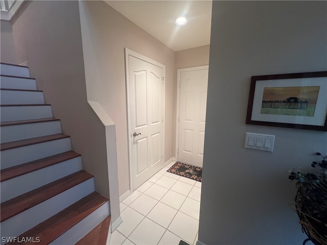 foyer entrance featuring light tile patterned floors