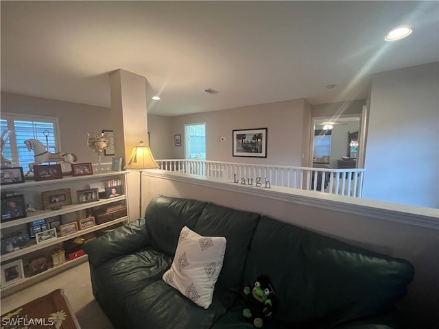 carpeted living room with plenty of natural light