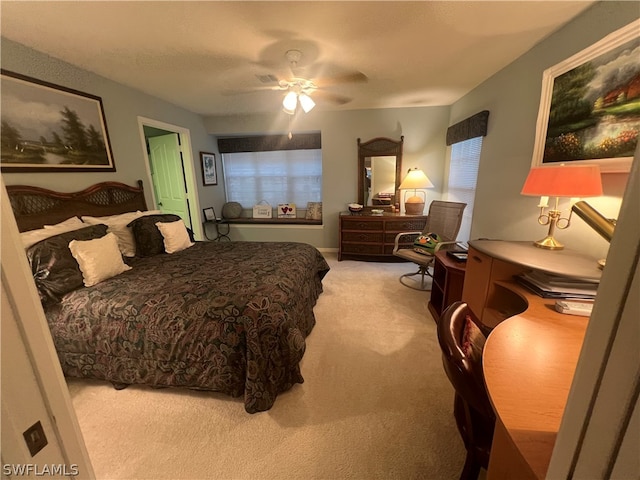 bedroom with light colored carpet and ceiling fan