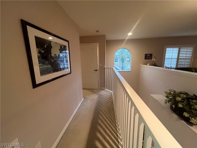 corridor with carpet flooring