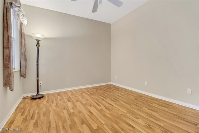 empty room with light hardwood / wood-style floors and ceiling fan