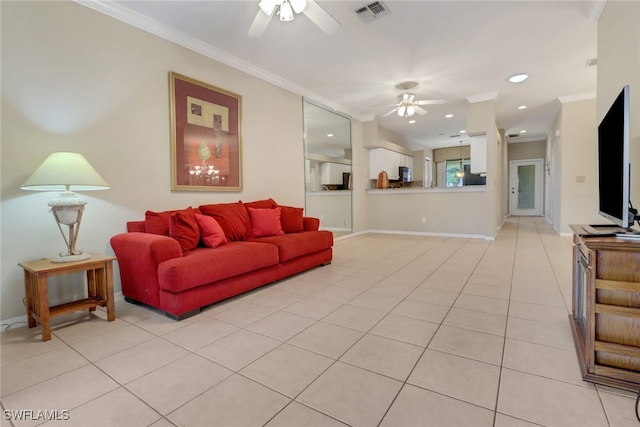 living room featuring light tile patterned floors, crown molding, and ceiling fan