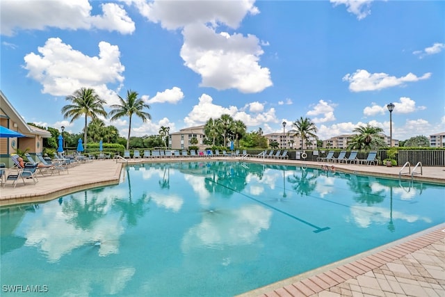 view of swimming pool featuring a patio area