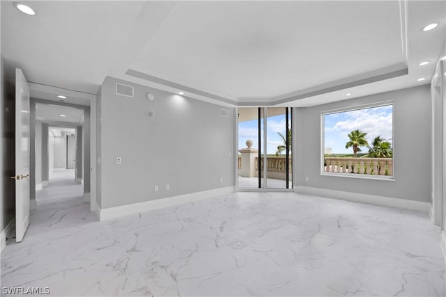 spare room with visible vents, crown molding, baseboards, recessed lighting, and a raised ceiling