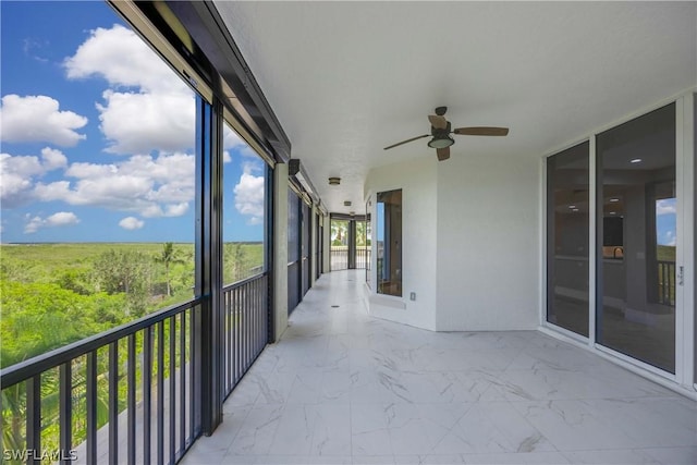 balcony featuring ceiling fan