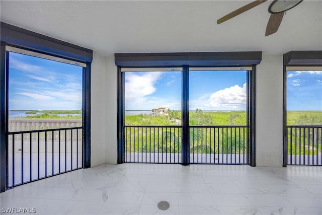 unfurnished sunroom with marble finish floor