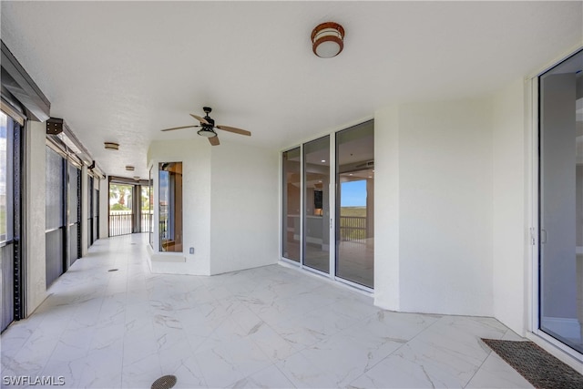 view of patio with ceiling fan