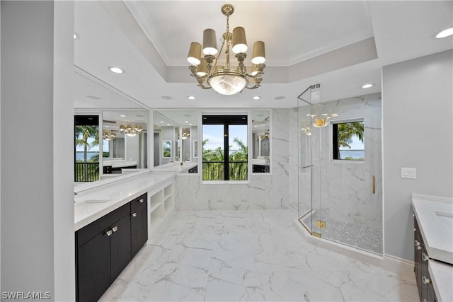 full bathroom featuring a marble finish shower, vanity, a tray ceiling, and a chandelier