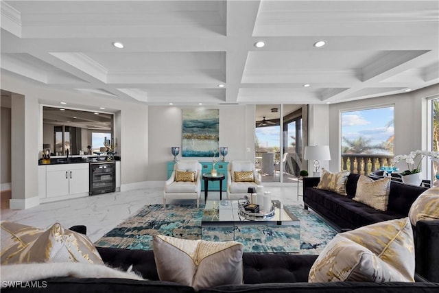 living room featuring crown molding, beam ceiling, coffered ceiling, wet bar, and beverage cooler