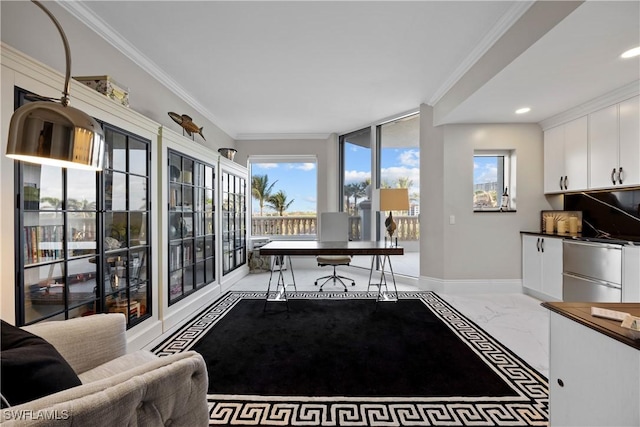 office space with marble finish floor, ornamental molding, and baseboards