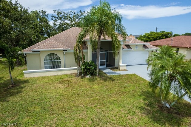 view of front of property with a garage and a front yard