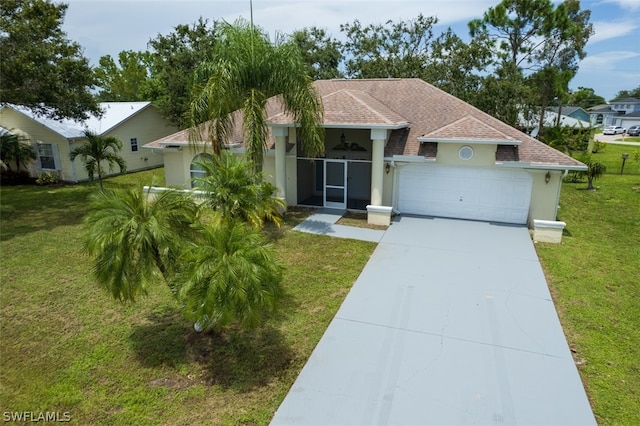 view of front of home featuring a garage and a front yard