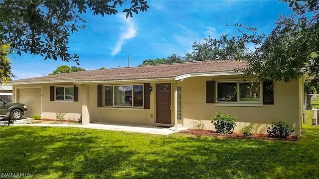 rear view of property featuring a lawn