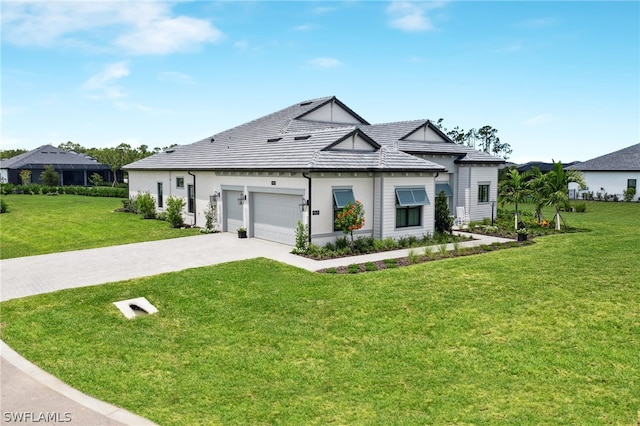 view of front facade featuring a garage, concrete driveway, a front lawn, and stucco siding