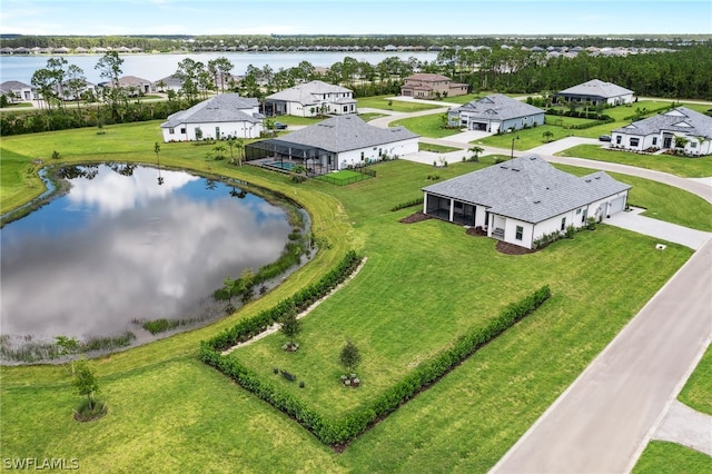 bird's eye view featuring a water view and a residential view