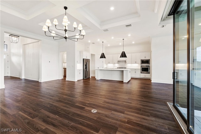 unfurnished living room with sink, a chandelier, coffered ceiling, dark hardwood / wood-style flooring, and beamed ceiling