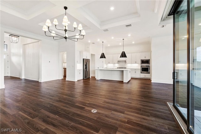 unfurnished living room with dark wood-style floors, visible vents, coffered ceiling, an inviting chandelier, and crown molding