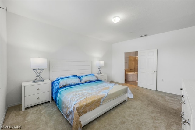 carpeted bedroom featuring connected bathroom