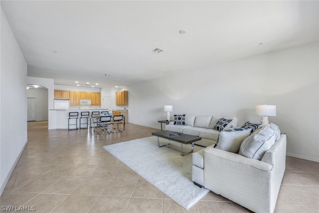 living room with light tile patterned floors