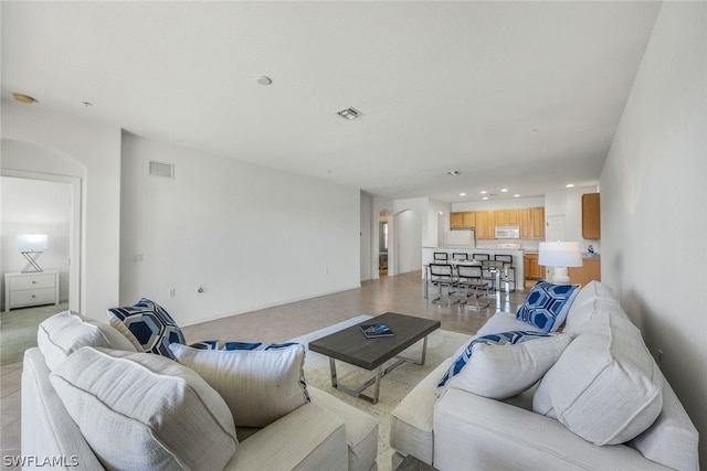 living room with light tile patterned floors