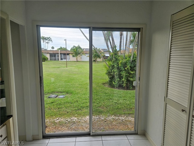 doorway to outside featuring light tile patterned floors