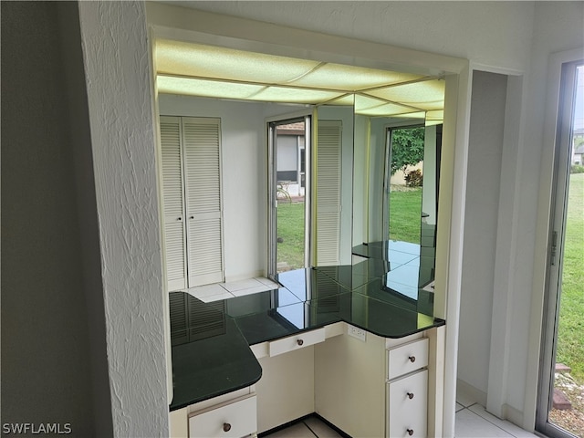 bathroom with tile patterned floors