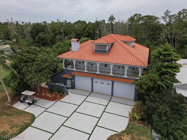 mediterranean / spanish house featuring a garage