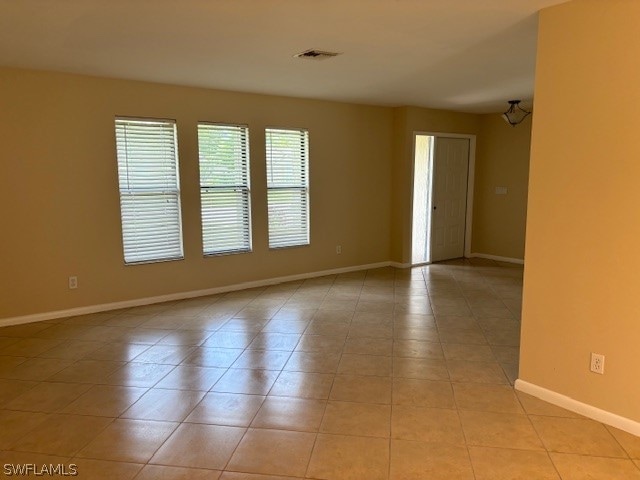 spare room with light tile patterned floors