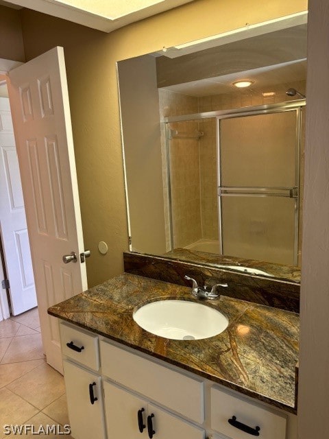 bathroom featuring vanity and tile patterned flooring