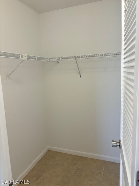 walk in closet featuring light tile patterned floors