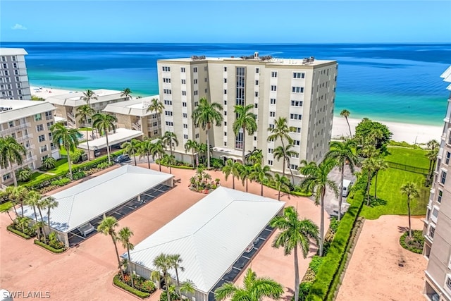 bird's eye view with a beach view and a water view