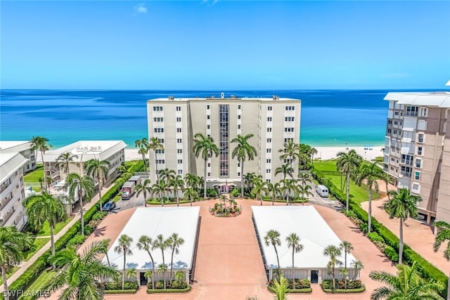 bird's eye view featuring a water view and a view of the beach