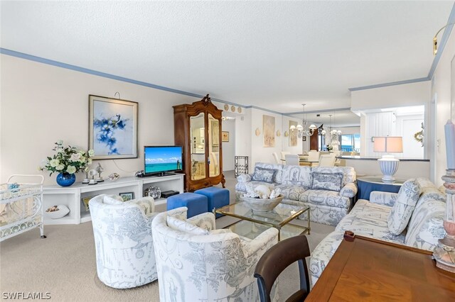 living room with an inviting chandelier, light colored carpet, ornamental molding, and a textured ceiling