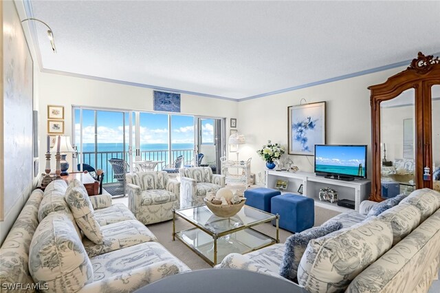 living room with carpet floors, ornamental molding, and a water view