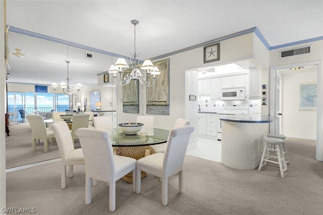 dining space with a notable chandelier, light colored carpet, and ornamental molding