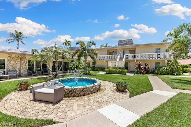 view of pool featuring a yard