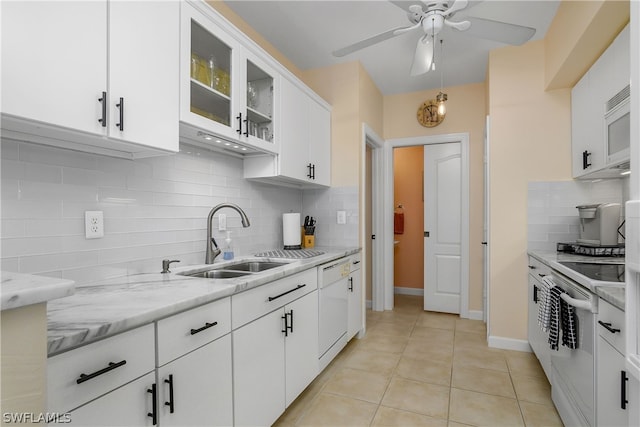 kitchen with white cabinetry, ceiling fan, tasteful backsplash, white appliances, and light tile patterned floors