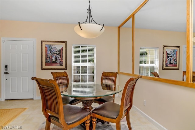 dining area with light tile patterned floors