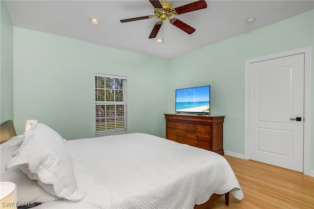 bedroom featuring light hardwood / wood-style flooring and ceiling fan