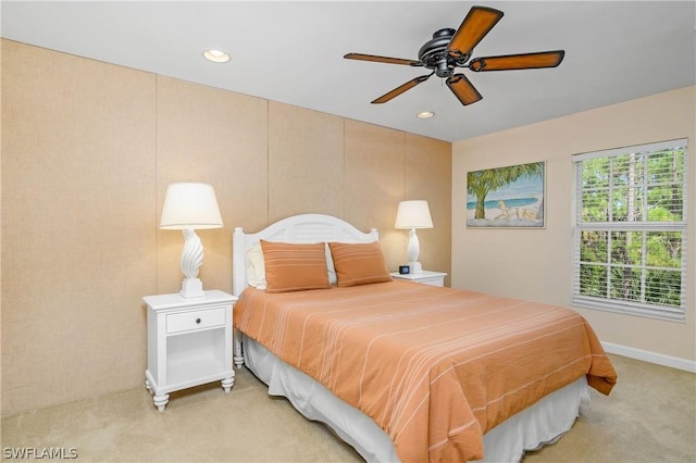 bedroom with light carpet and ceiling fan