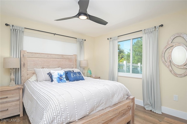 bedroom featuring hardwood / wood-style flooring and ceiling fan