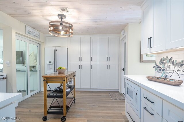 kitchen featuring white cabinetry and wood ceiling