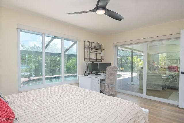 bedroom with access to outside, multiple windows, ceiling fan, and light wood-type flooring