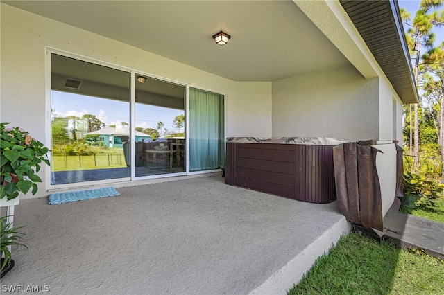 view of patio featuring a hot tub