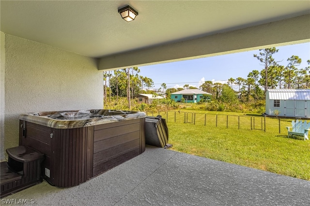 view of patio / terrace with a hot tub