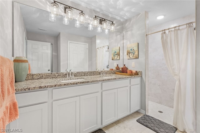 bathroom featuring vanity and a shower with curtain