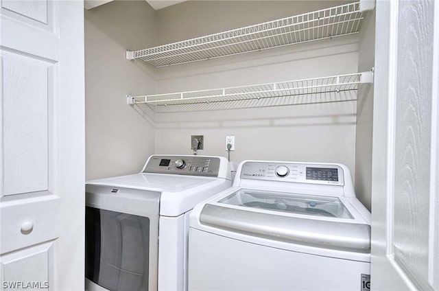 washroom featuring separate washer and dryer