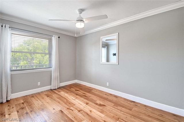 spare room featuring ceiling fan, ornamental molding, and light hardwood / wood-style flooring